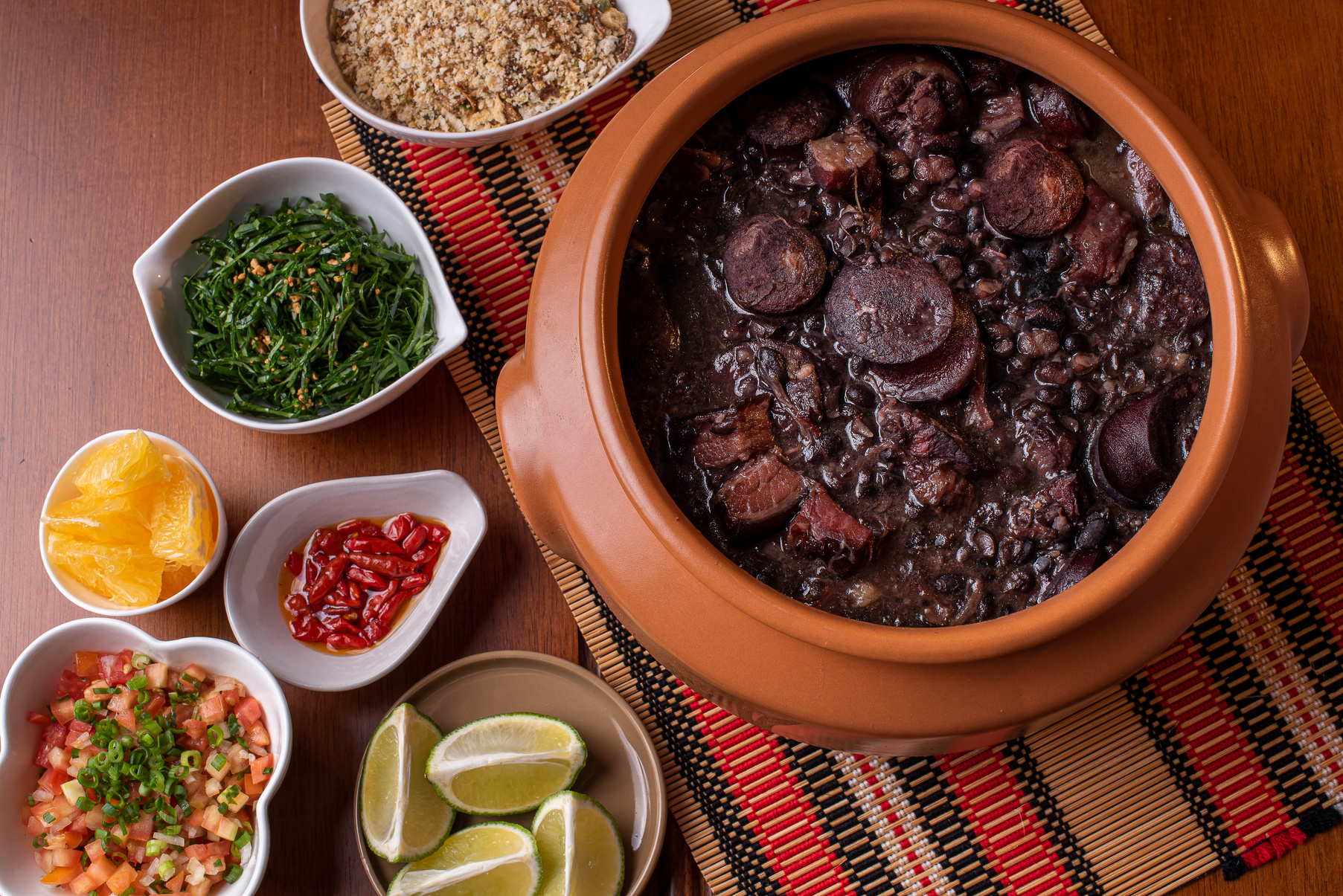 Traditional Brazilian food called Feijoada. Black beans with pork